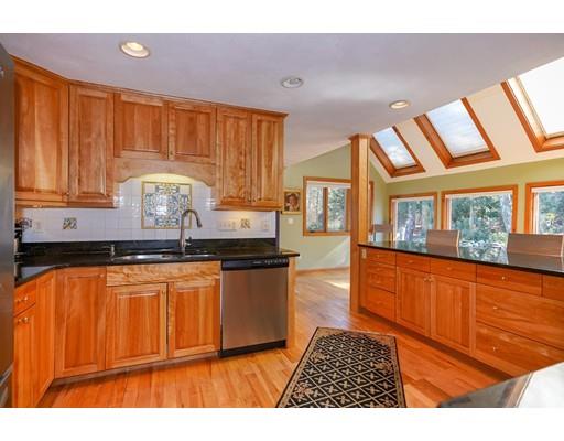 371 Sargent Road Boxborough, MA 01719 - Photo 4 of 30 a kitchen with granite countertop wooden cabinets a sink and a stove