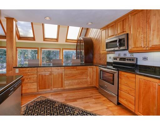 371 Sargent Road Boxborough, MA 01719 - Photo 5 of 30 a kitchen with stainless steel appliances granite countertop a stove a sink and a microwave