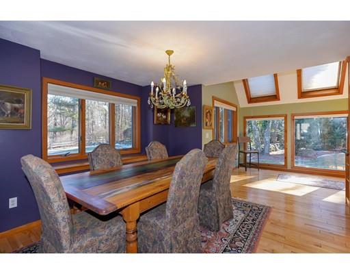 371 Sargent Road Boxborough, MA 01719 - Photo 9 of 30 a living room with furniture a chandelier and a dining table
