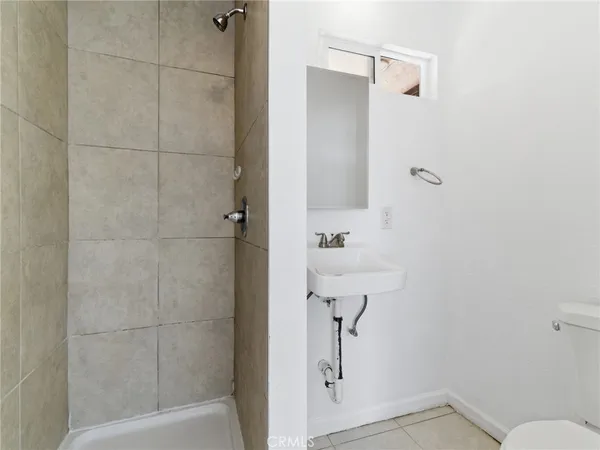 a bathroom with a shower and toilet