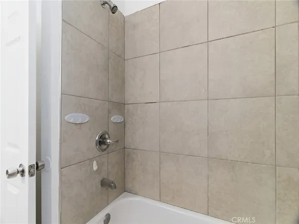 a bathroom with a toilet and shower