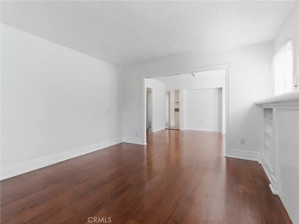 a view of a livingroom with wooden floor