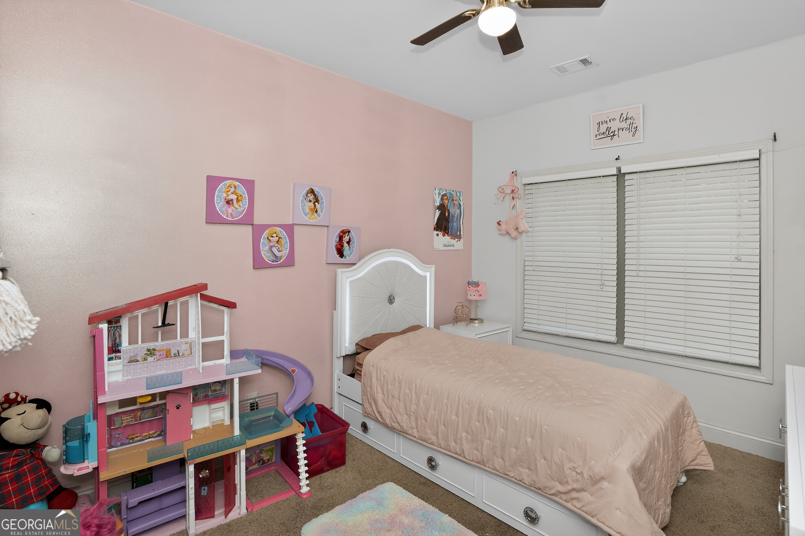 39 Crow Court Monticello, GA 31064 - Photo 22 of 39 a bedroom with a bed and a chandelier