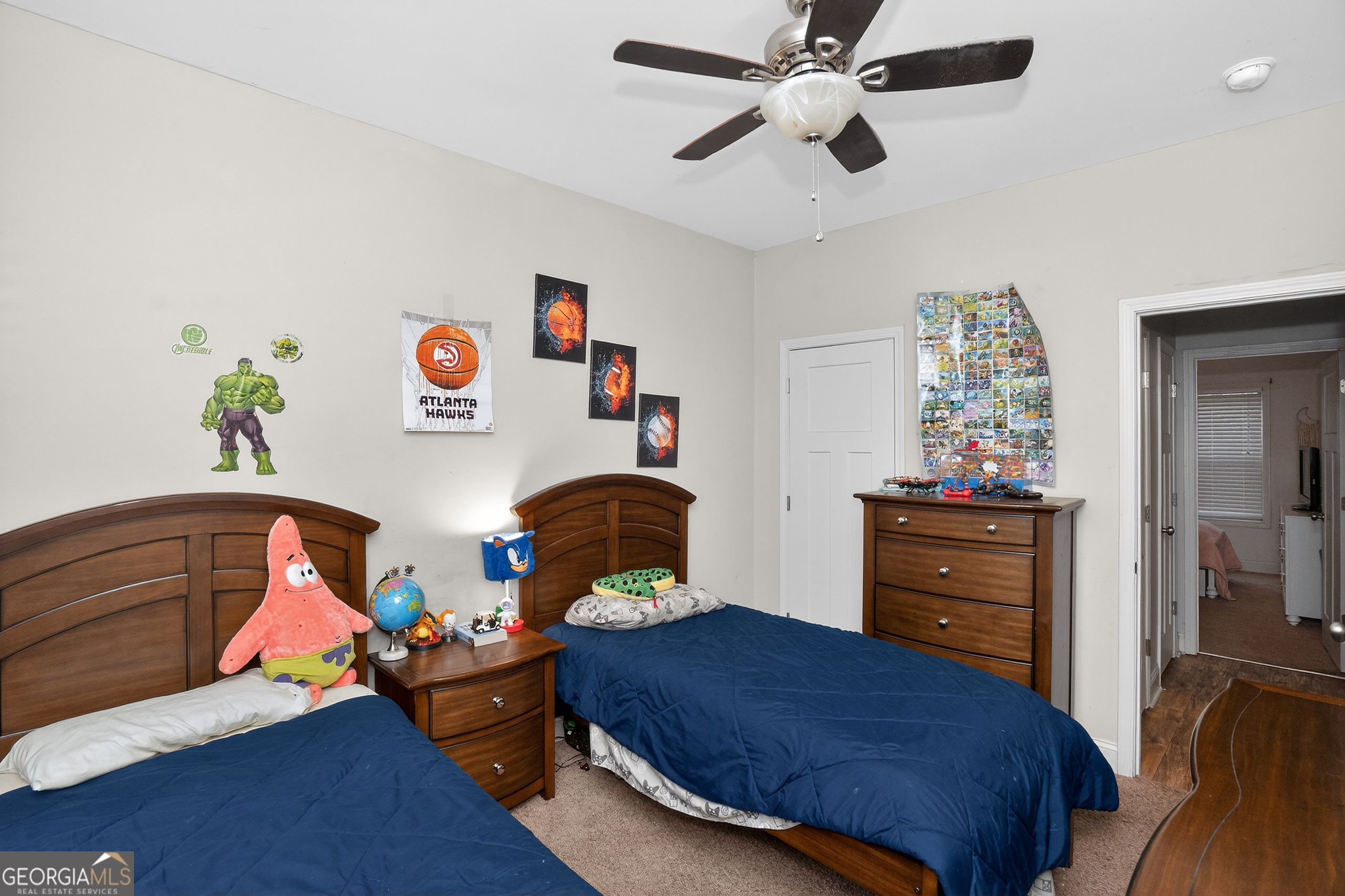 39 Crow Court Monticello, GA 31064 - Photo 27 of 39 a bedroom with a bed and wooden floor