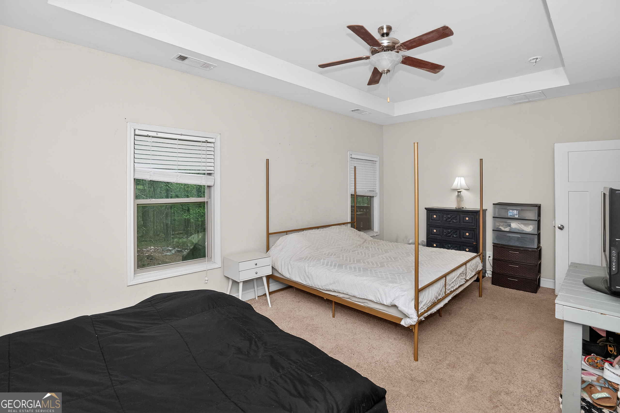 39 Crow Court Monticello, GA 31064 - Photo 33 of 39 a bedroom with a bed and a window