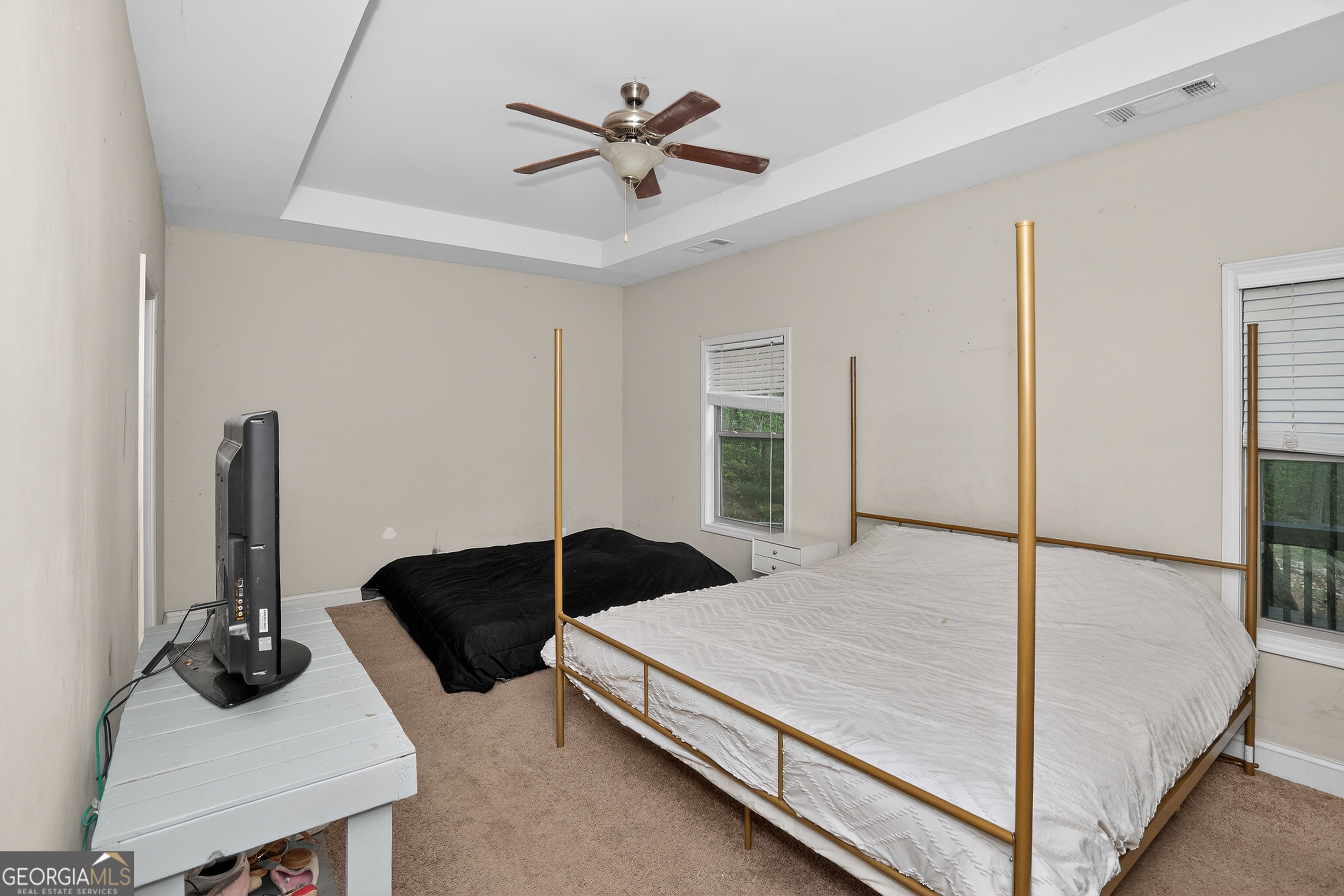 39 Crow Court Monticello, GA 31064 - Photo 34 of 39 a bedroom with a bed and a table
