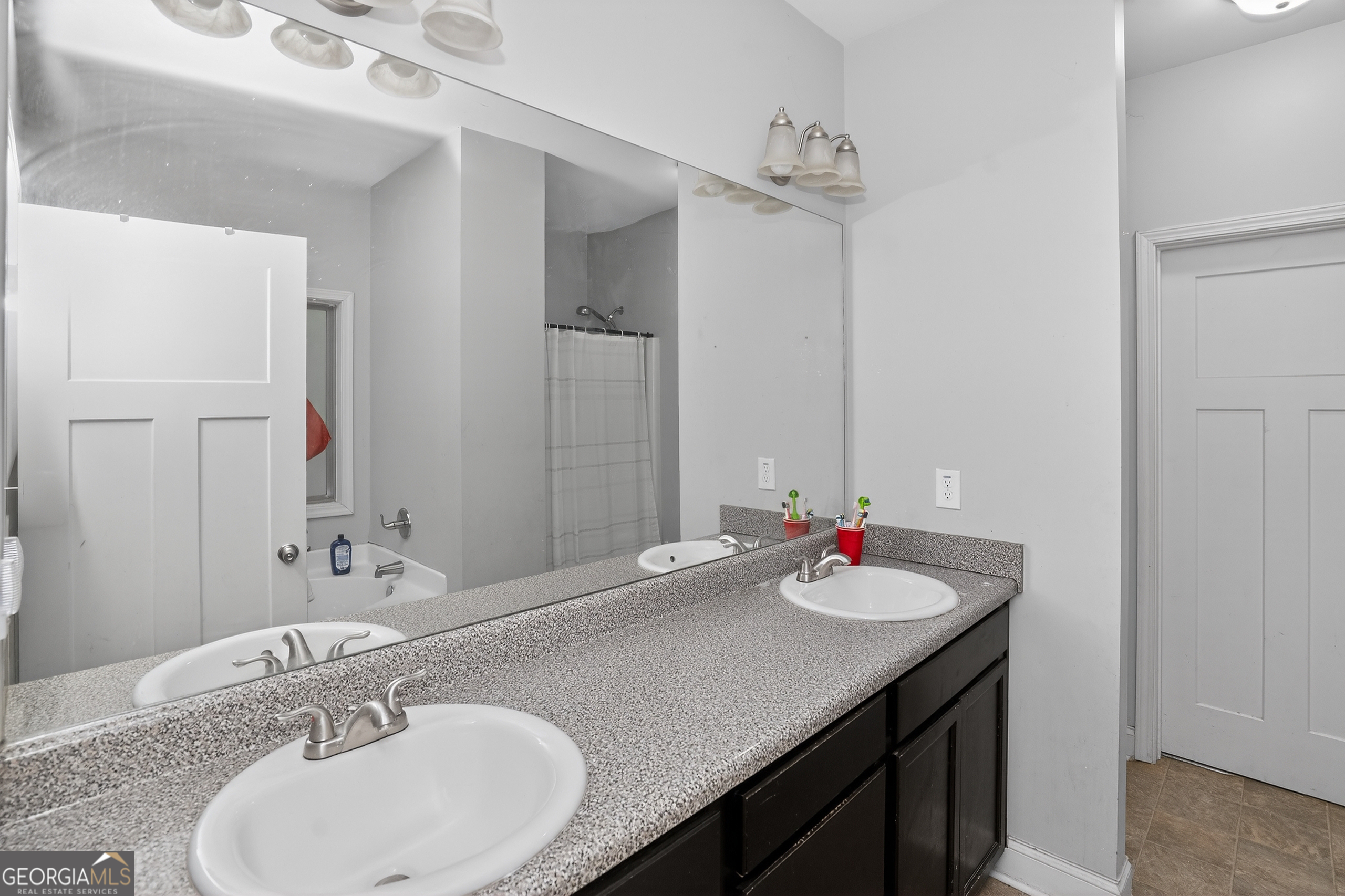 39 Crow Court Monticello, GA 31064 - Photo 35 of 39 a bathroom with a sink and a mirror