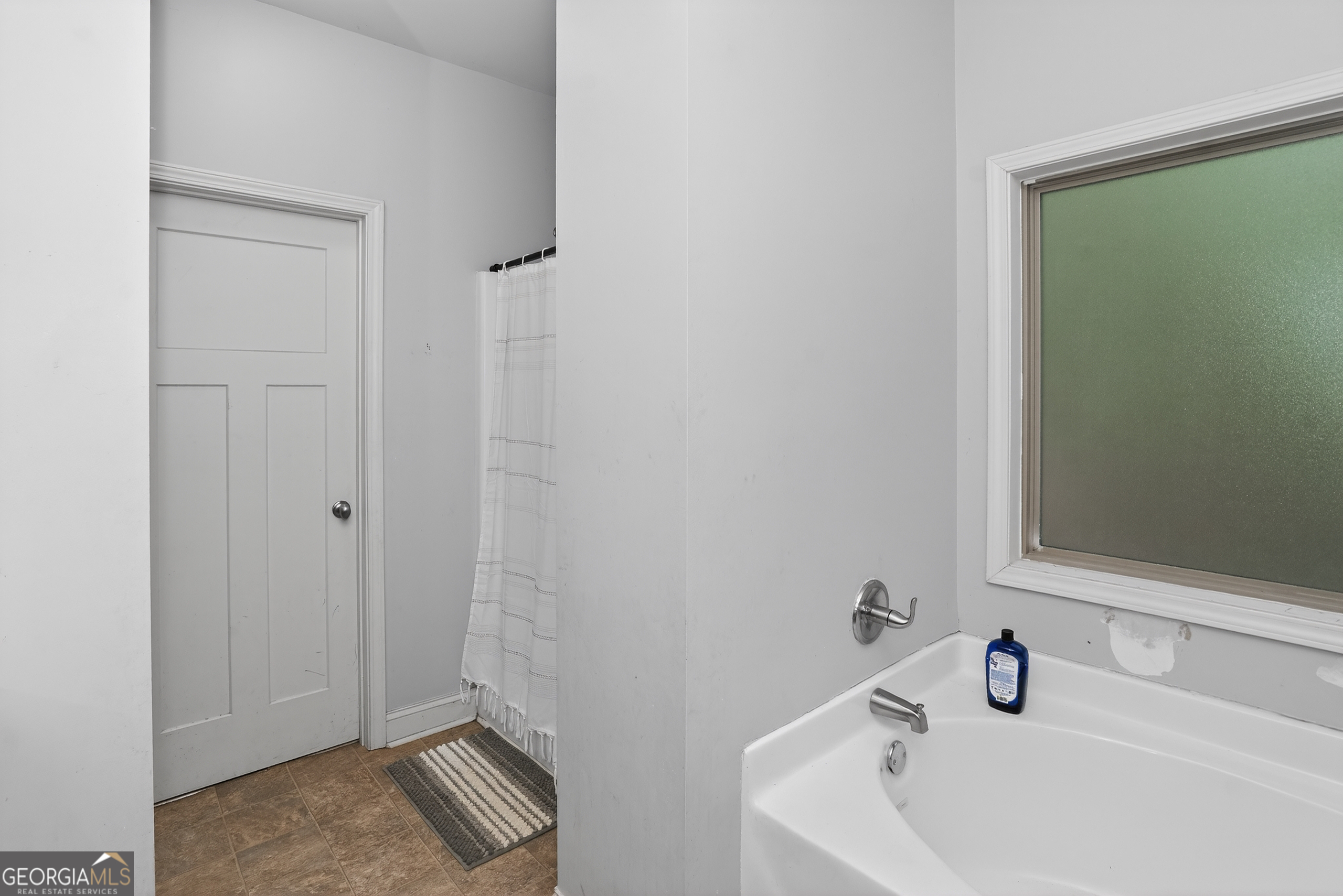 39 Crow Court Monticello, GA 31064 - Photo 36 of 39 a bathroom with a sink and a mirror