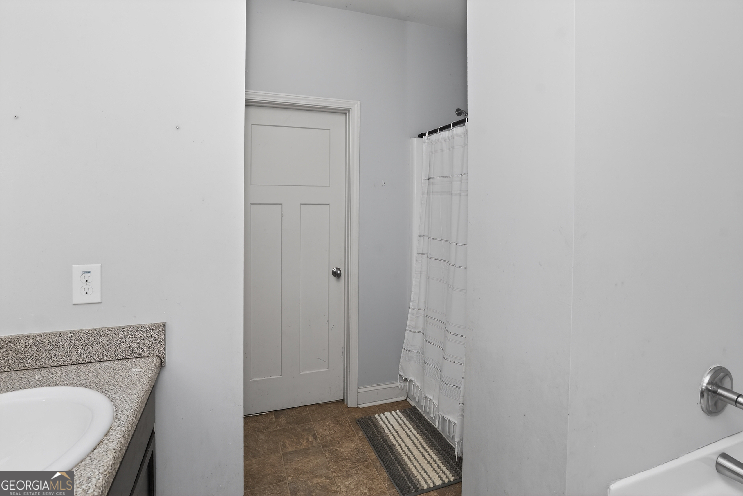 39 Crow Court Monticello, GA 31064 - Photo 37 of 39 a bathroom with a granite countertop sink a toilet and shower