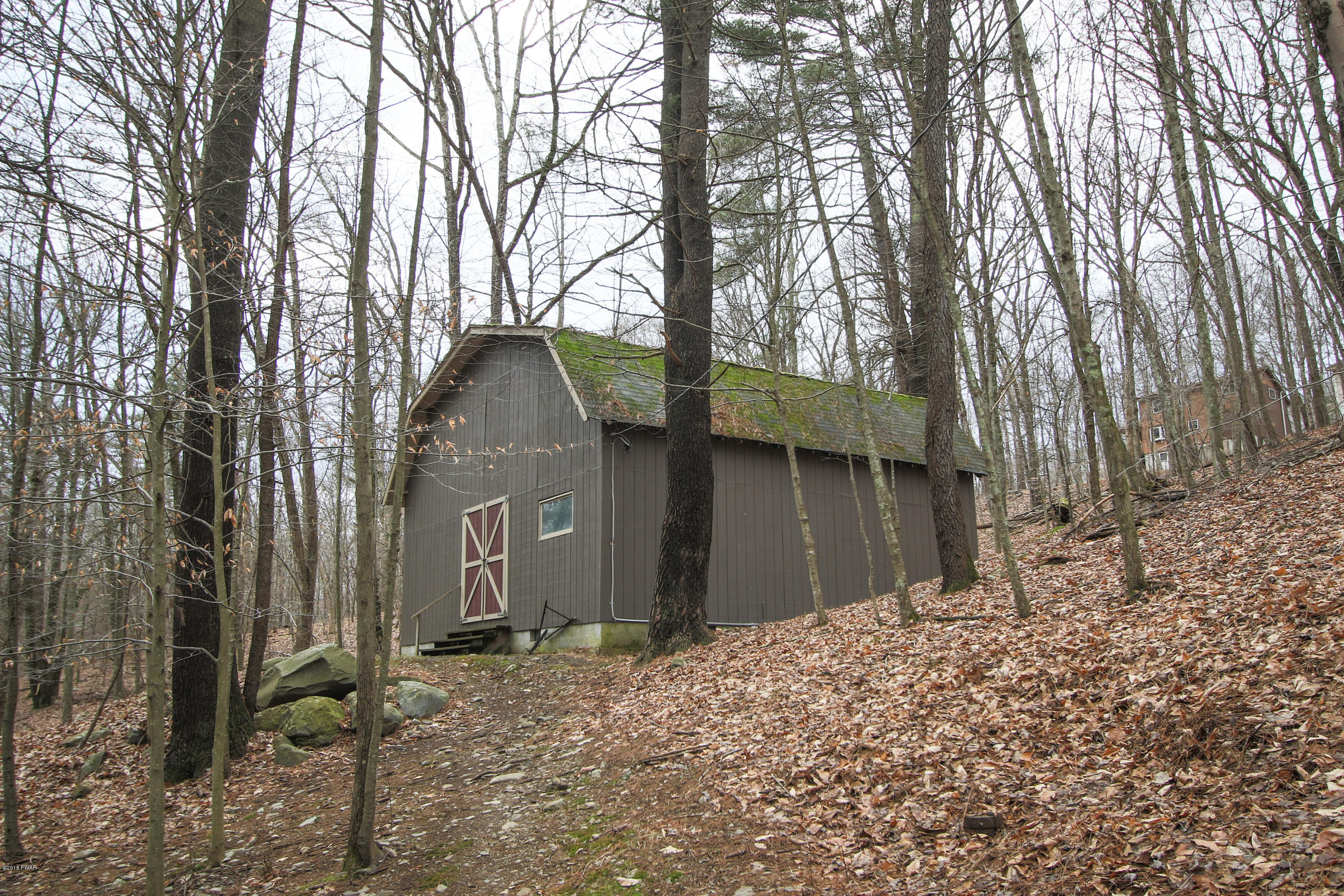 139 Raccoon Court Bushkill, PA 18324 - Photo 16 of 17 a front view of a house with a yard and garage