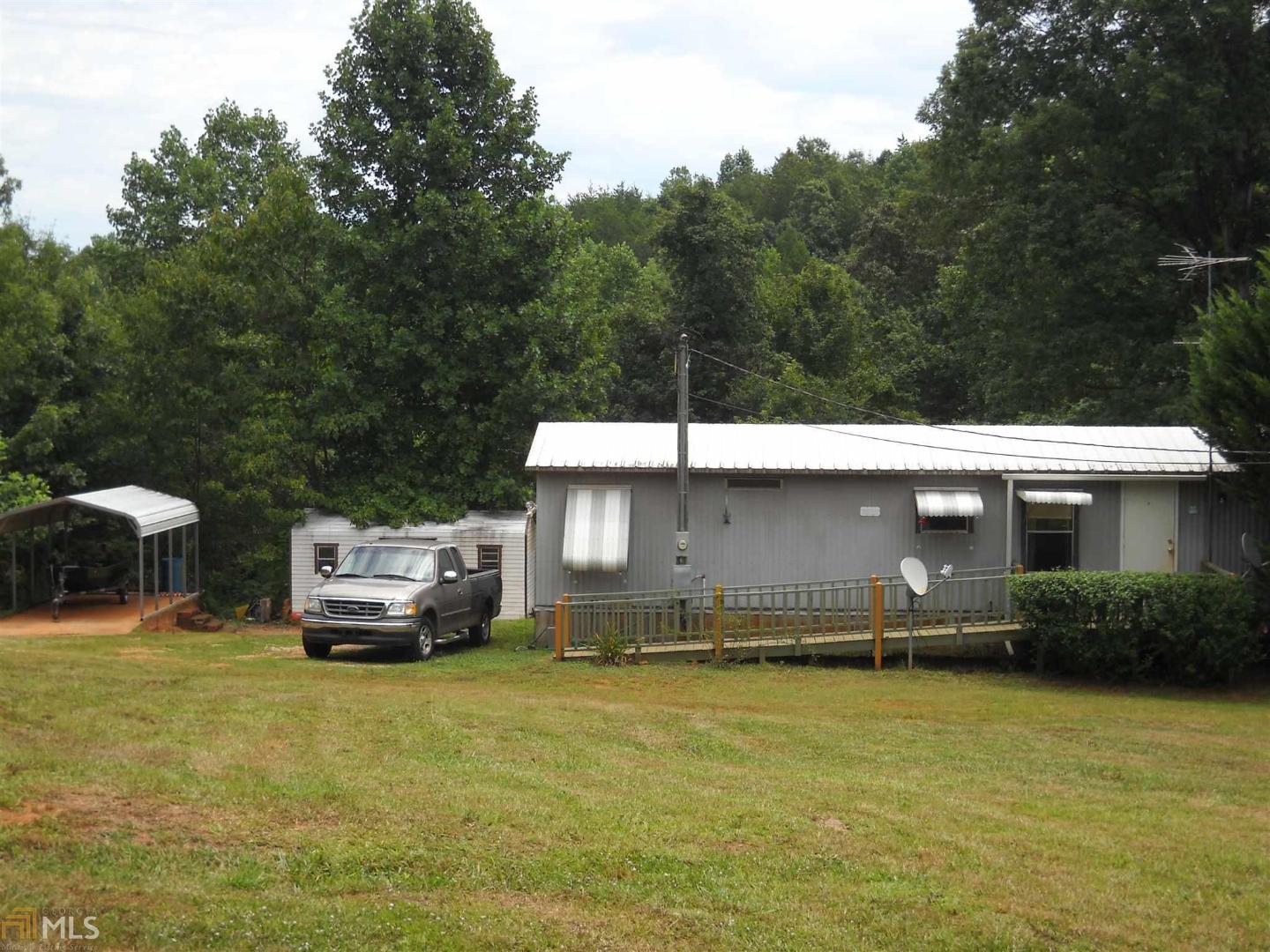 227 Old Jarrett Road Toccoa, GA 30577 - Photo 1 of 1 a car parked in front of a house