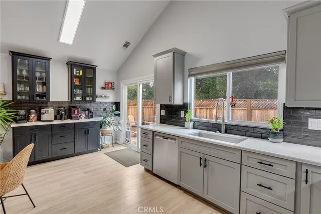 a kitchen with sink and cabinets