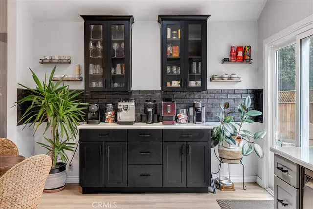 a kitchen with a refrigerator and a table