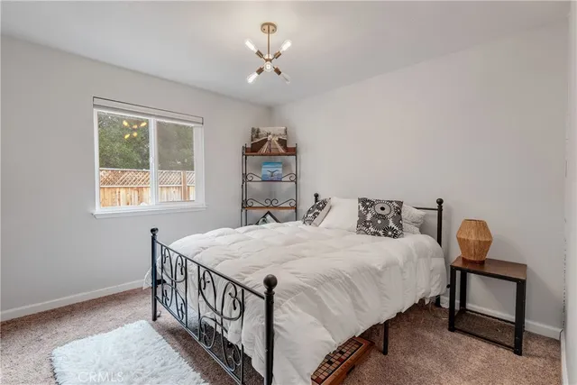 a bedroom with bed and a window