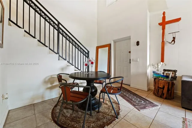 a dining room with furniture window and entryway