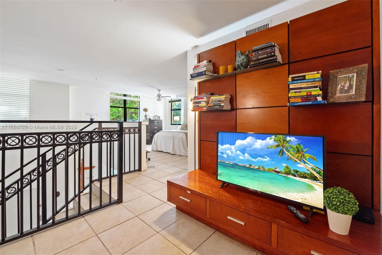 888 Douglas Road, Unit 113 Coral Gables, FL 33134 - Photo 24 of 40 a wooden bench sitting in front of a building