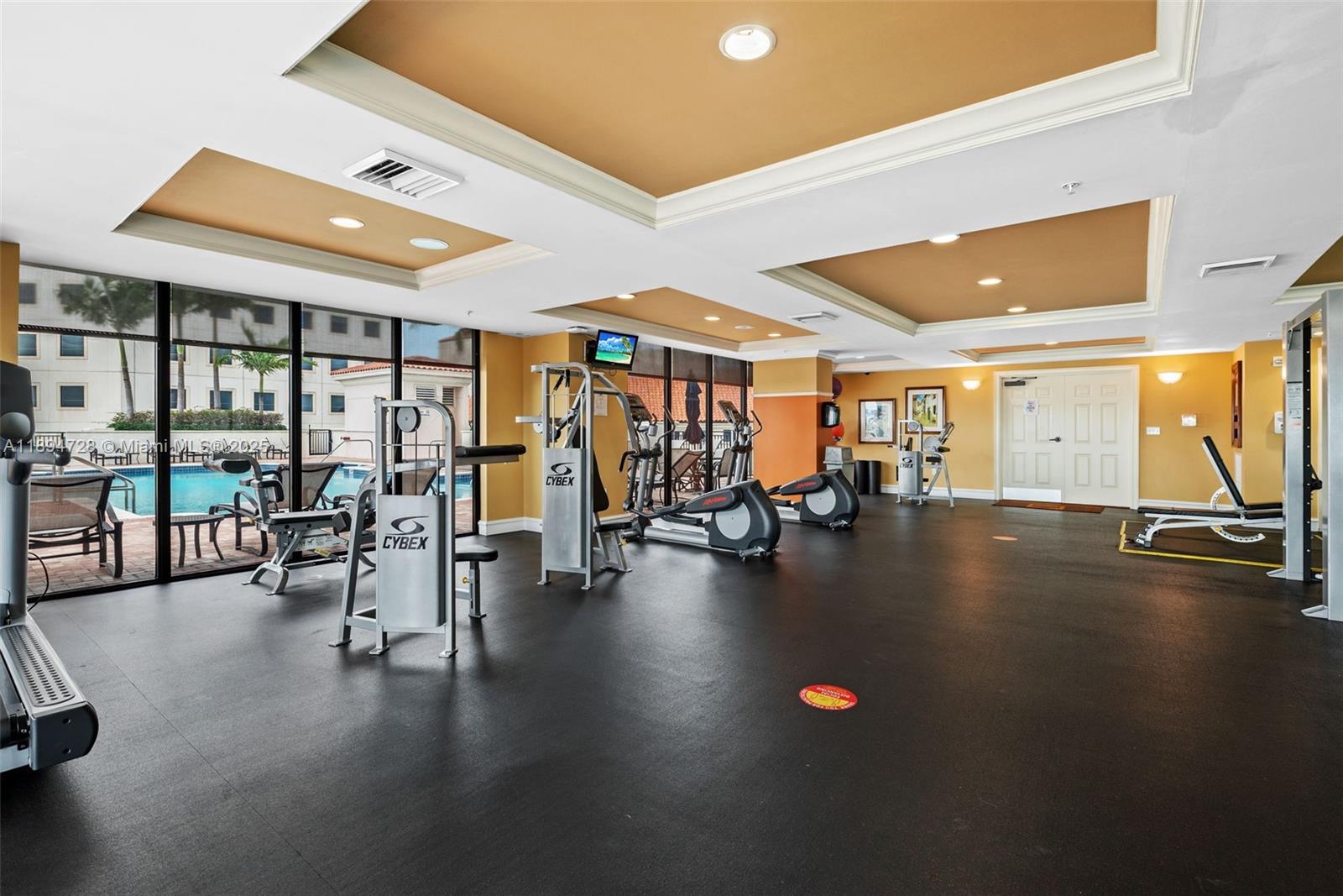 888 Douglas Road, Unit 113 Coral Gables, FL 33134 - Photo 33 of 40 a view of a room with gym equipment