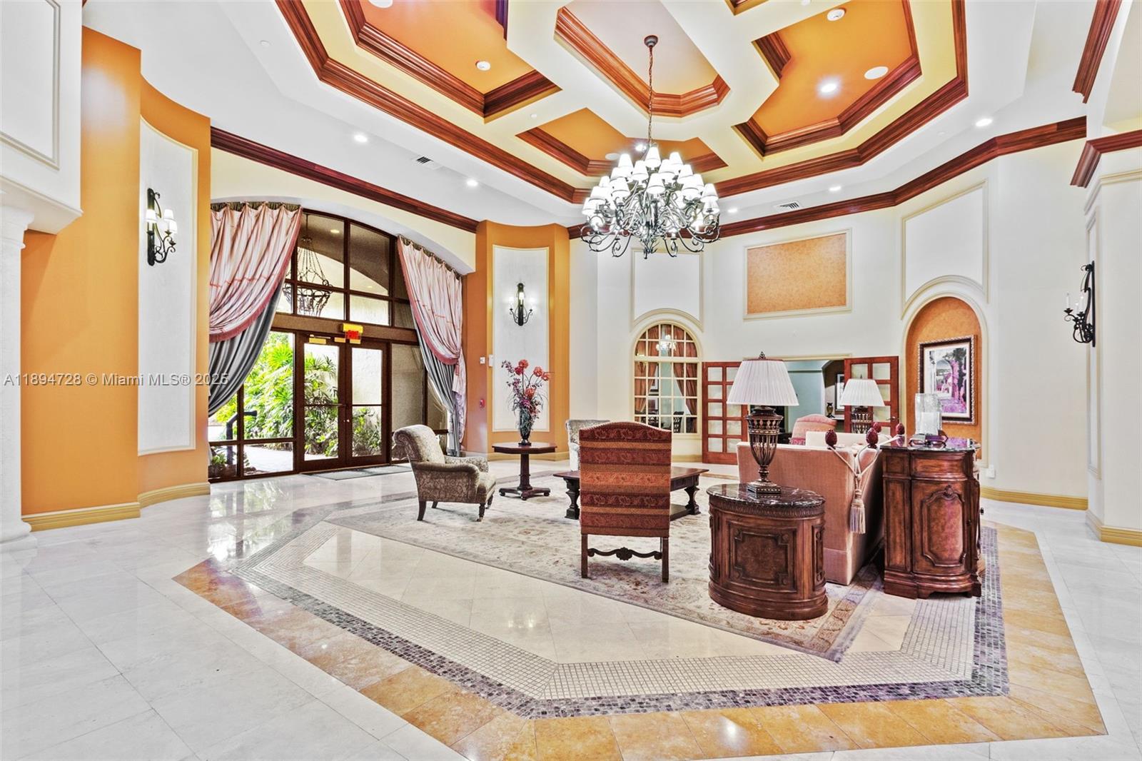 888 Douglas Road, Unit 113 Coral Gables, FL 33134 - Photo 5 of 40 a living room with chandelier furniture and a large window