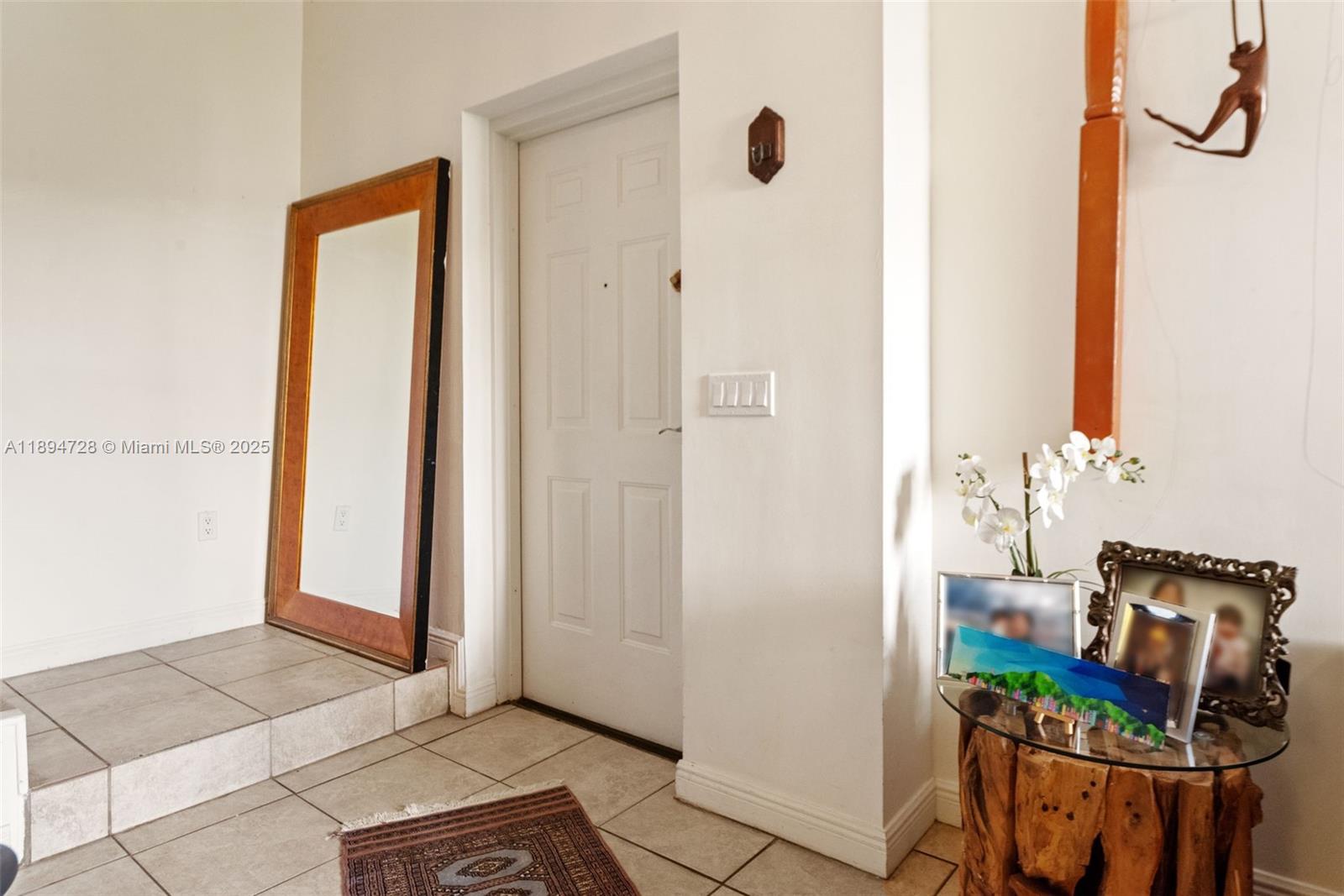 888 Douglas Road, Unit 113 Coral Gables, FL 33134 - Photo 10 of 40 a view of an entryway with wooden floor