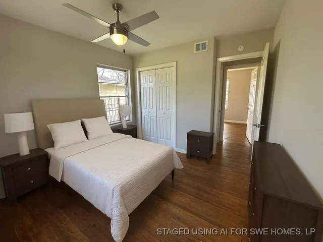 a bedroom with a bed and a couch