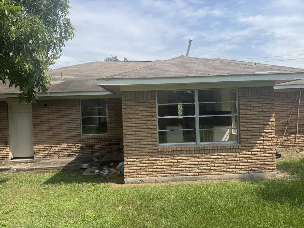 205 West Rittenhouse Street Houston, TX 77076 - Photo 15 of 17 a front view of a house with a yard