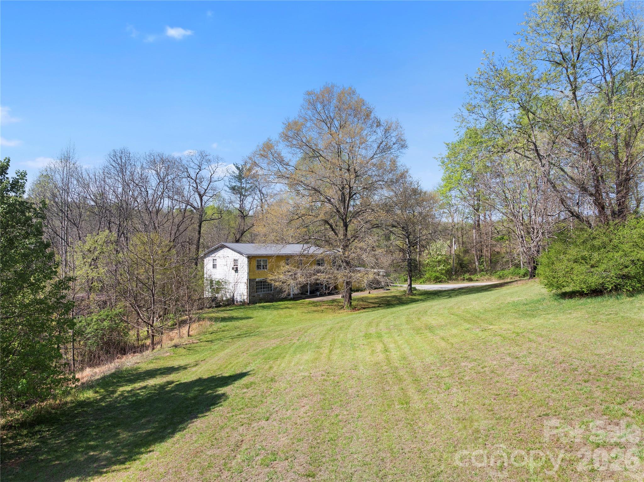 4675 Hickory Nut Ridge Road Granite Falls, NC 28630 - Photo 4 of 14 a view of a big yard with large trees