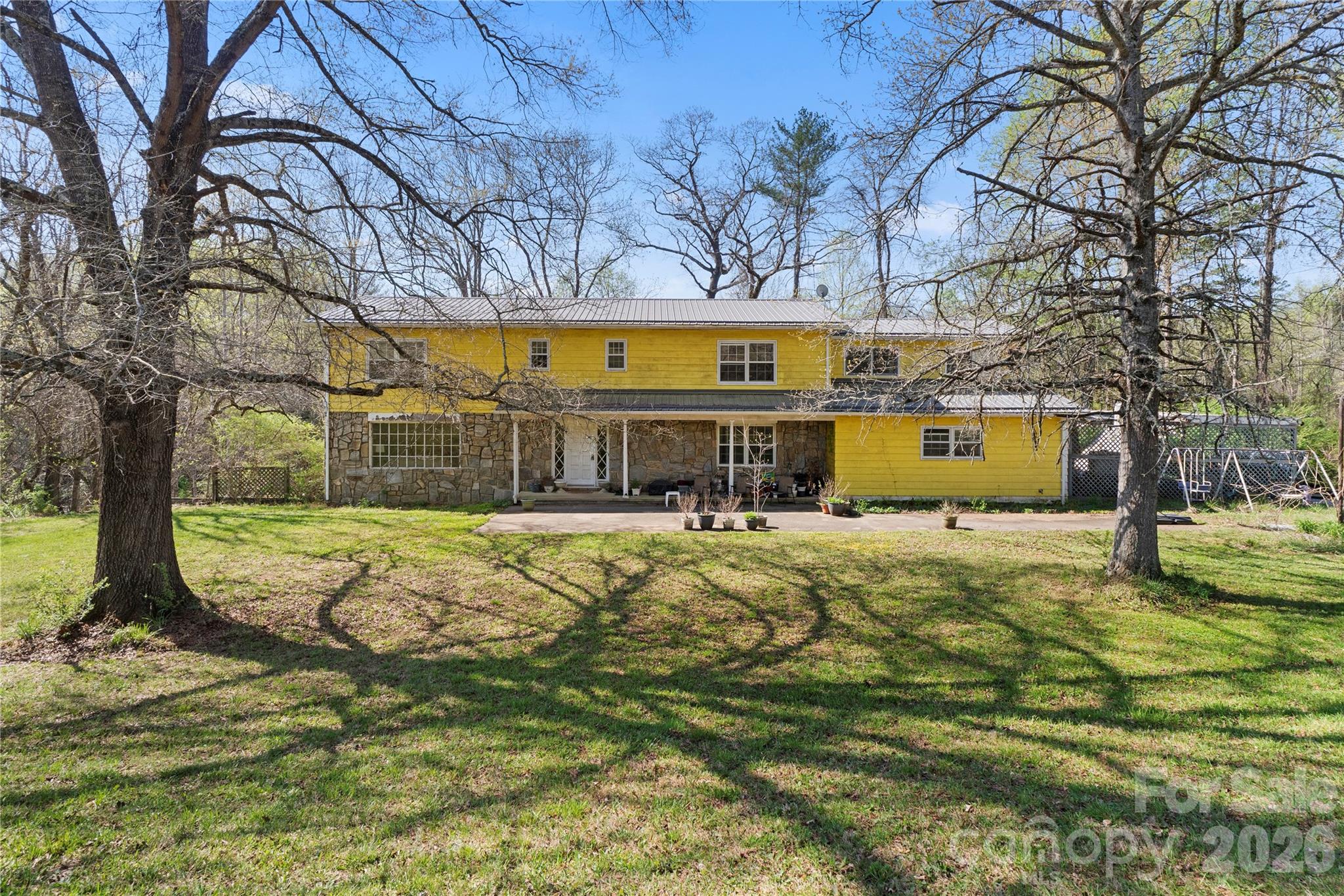 4675 Hickory Nut Ridge Road Granite Falls, NC 28630 - Photo 7 of 14 a front view of a house with swimming pool