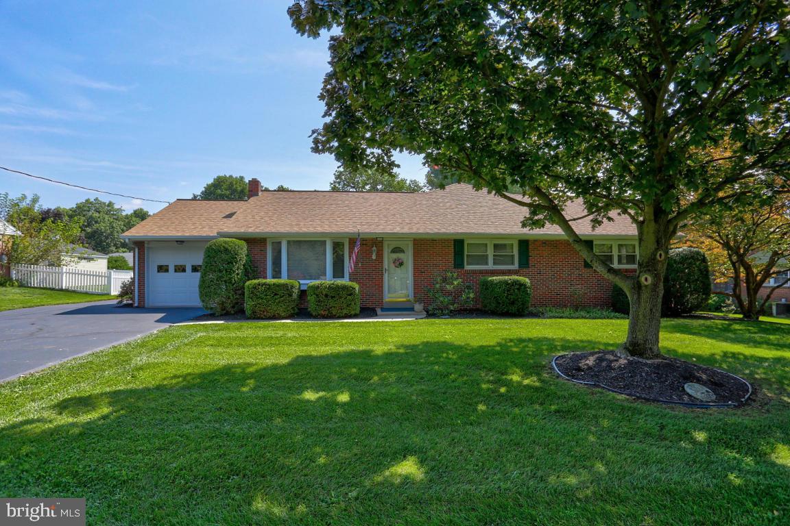 106 Brubaker Road Lititz, PA 17543 - Photo 1 of 25 a front view of a house with a garden