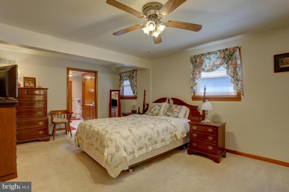106 Brubaker Road Lititz, PA 17543 - Photo 17 of 25 a bedroom with a bed and a chandelier