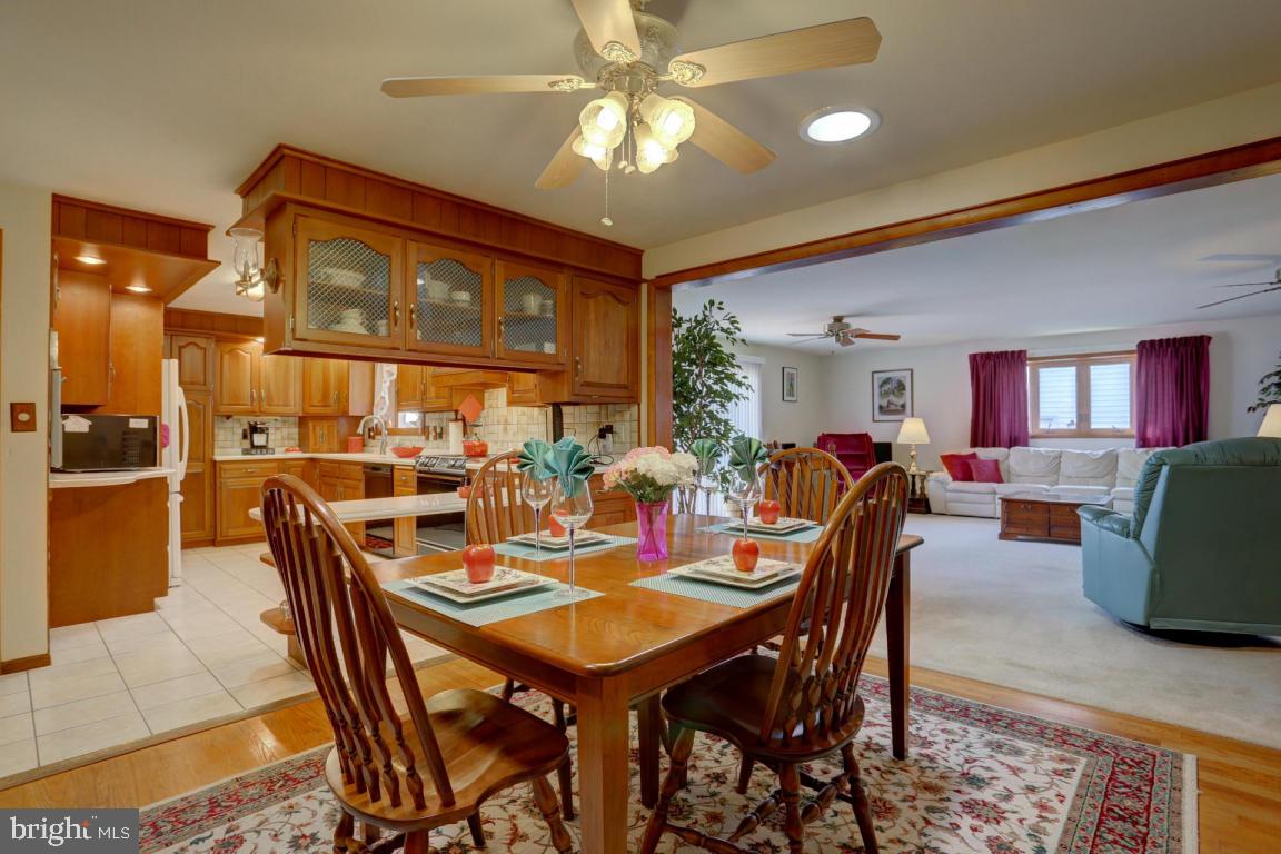 106 Brubaker Road Lititz, PA 17543 - Photo 6 of 25 a dining room with furniture a rug and a chandelier
