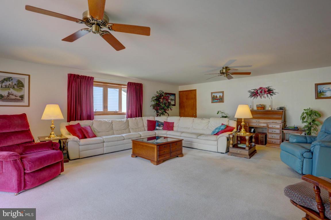 106 Brubaker Road Lititz, PA 17543 - Photo 7 of 25 a living room with furniture and a chandelier