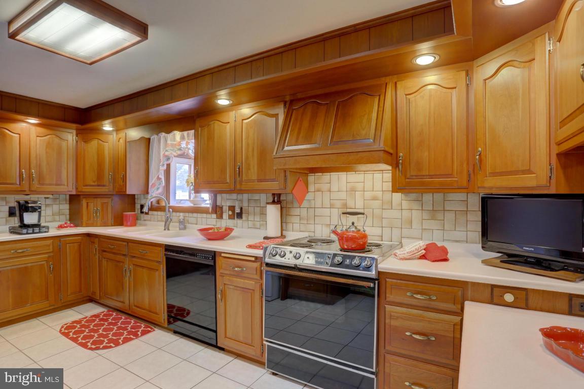 106 Brubaker Road Lititz, PA 17543 - Photo 8 of 25 a kitchen with a sink stove and cabinets
