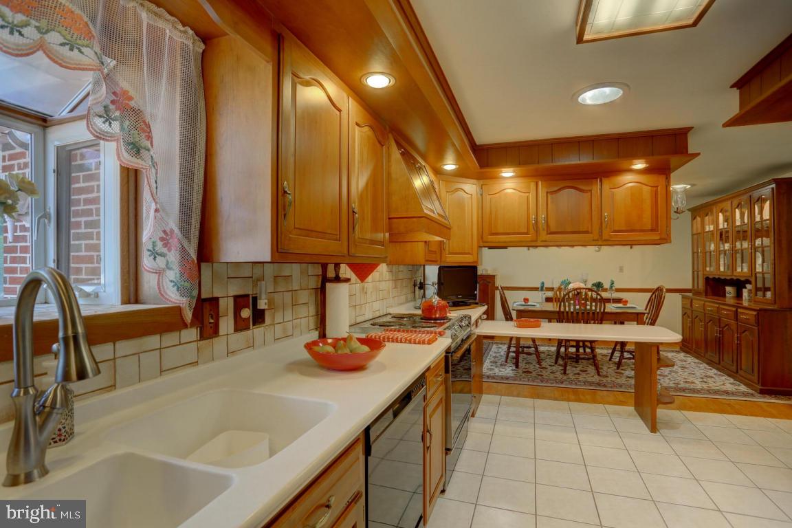 106 Brubaker Road Lititz, PA 17543 - Photo 9 of 25 a kitchen with a sink and chairs