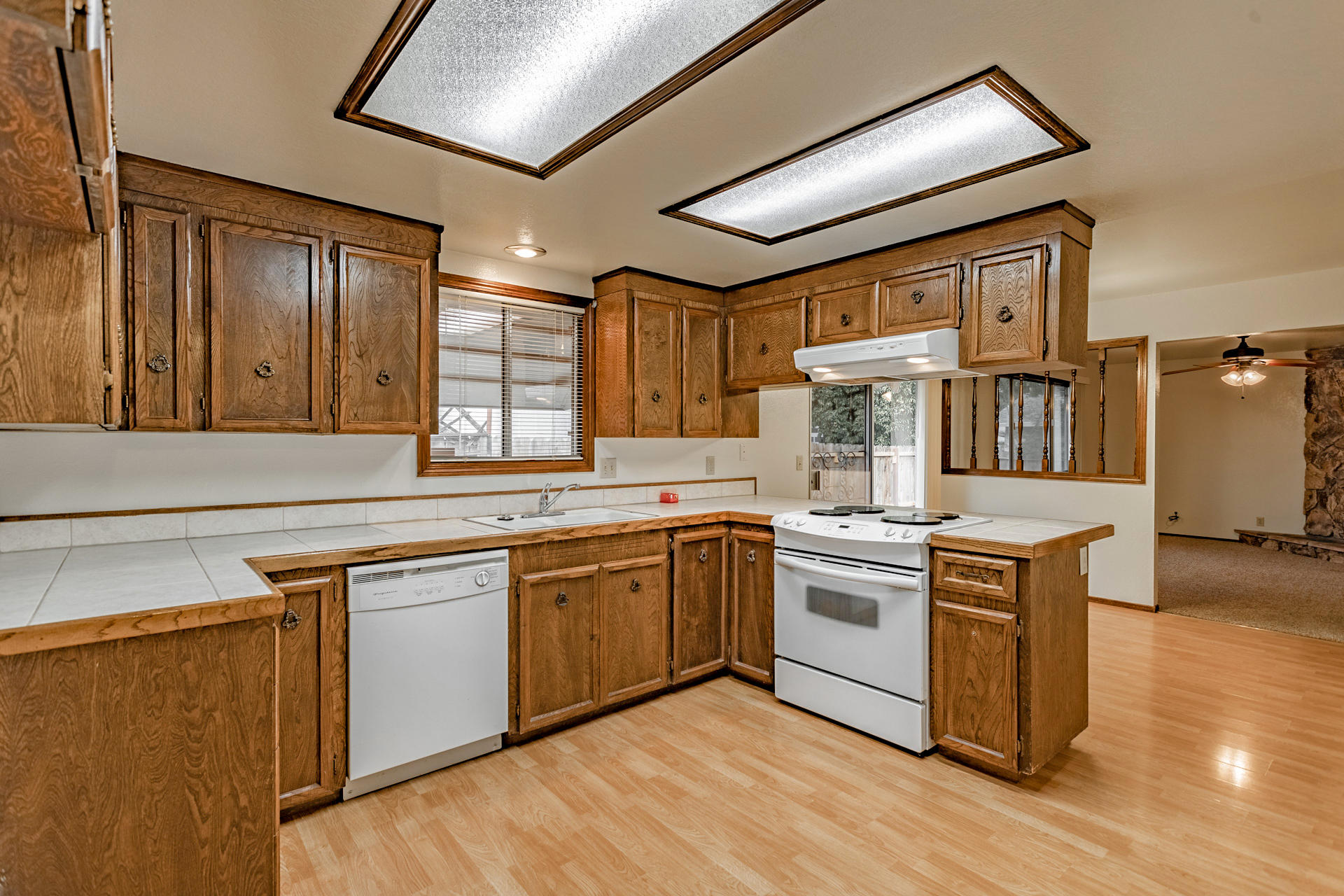 3612 Echo Road Redding, CA 96002 - Photo 5 of 10 a kitchen with stainless steel appliances granite countertop a stove and a sink
