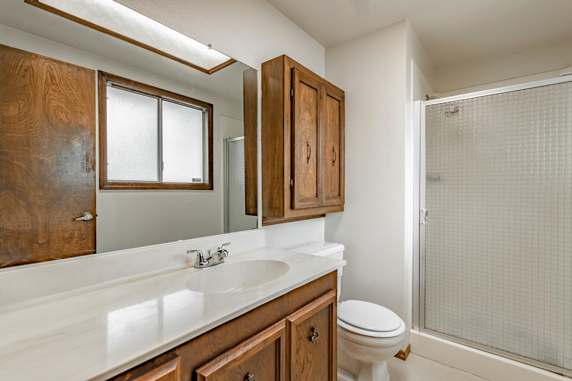 3612 Echo Road Redding, CA 96002 - Photo 7 of 10 a bathroom with a granite countertop sink toilet and shower