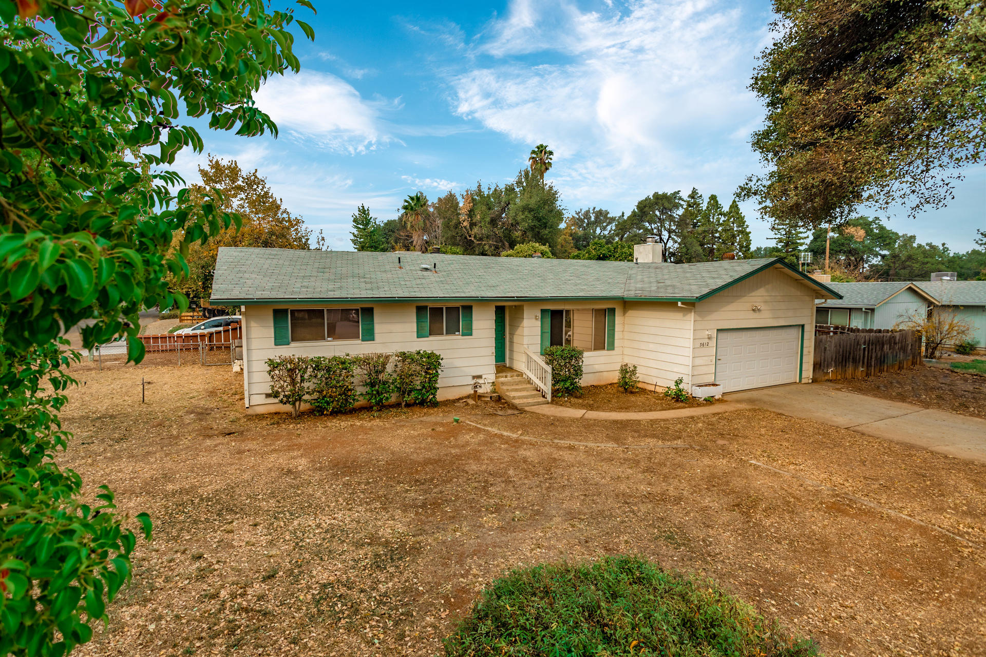 3612 Echo Road Redding, CA 96002 - Photo 10 of 10 a view of a house with backyard and a tree