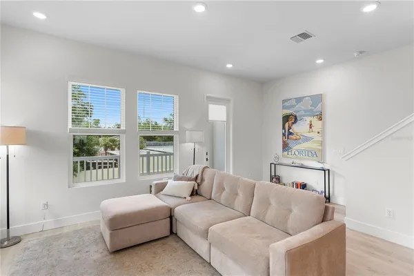 a living room with furniture and a window