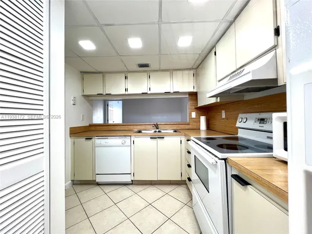 a kitchen with a stove and a microwave