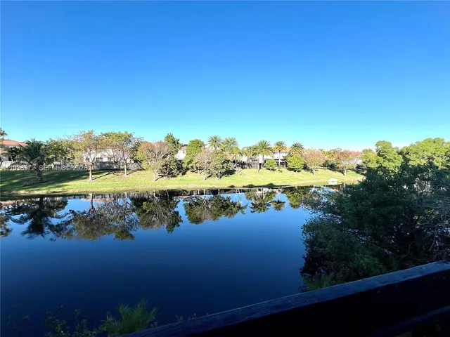 a view of a lake with a city