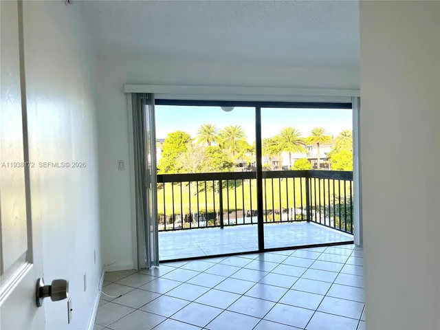 a view of a park with large trees