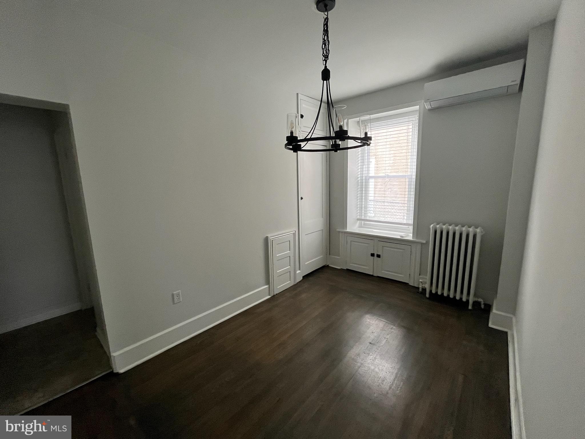 357 Lyceum Avenue, Unit A Philadelphia, PA 19128 - Photo 5 of 14 a view of empty room with wooden floor and fan