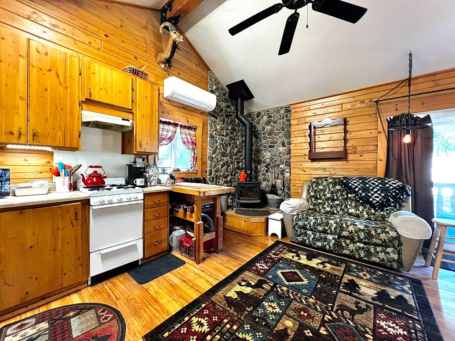 9110 Hidden Valley Road Mountain Ranch, CA 95246 - Photo 14 of 44 a kitchen with granite countertop a stove a sink and a refrigerator