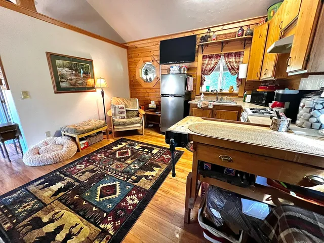 a kitchen with stainless steel appliances granite countertop a stove and a refrigerator