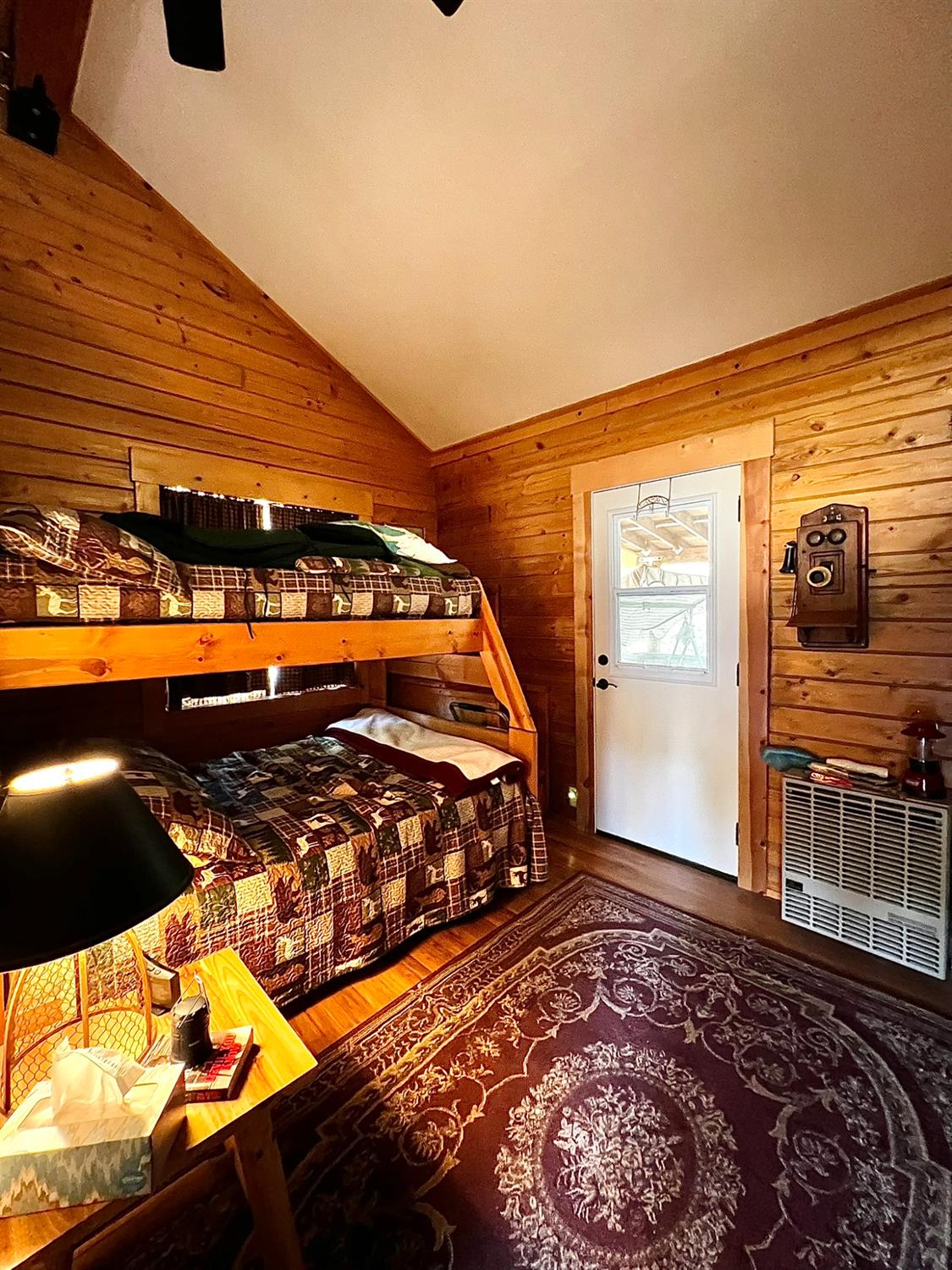 9110 Hidden Valley Road Mountain Ranch, CA 95246 - Photo 16 of 44 a bed sitting in a bedroom next to a window