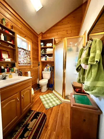 a bed room with a bed and a mirror