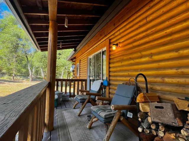 a front view of a house with outdoor seating