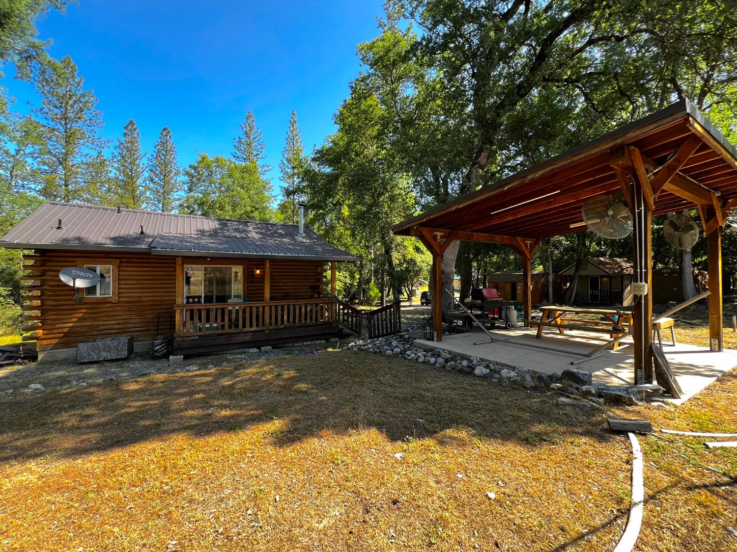 9110 Hidden Valley Road Mountain Ranch, CA 95246 - Photo 2 of 44 a view of a house with a patio