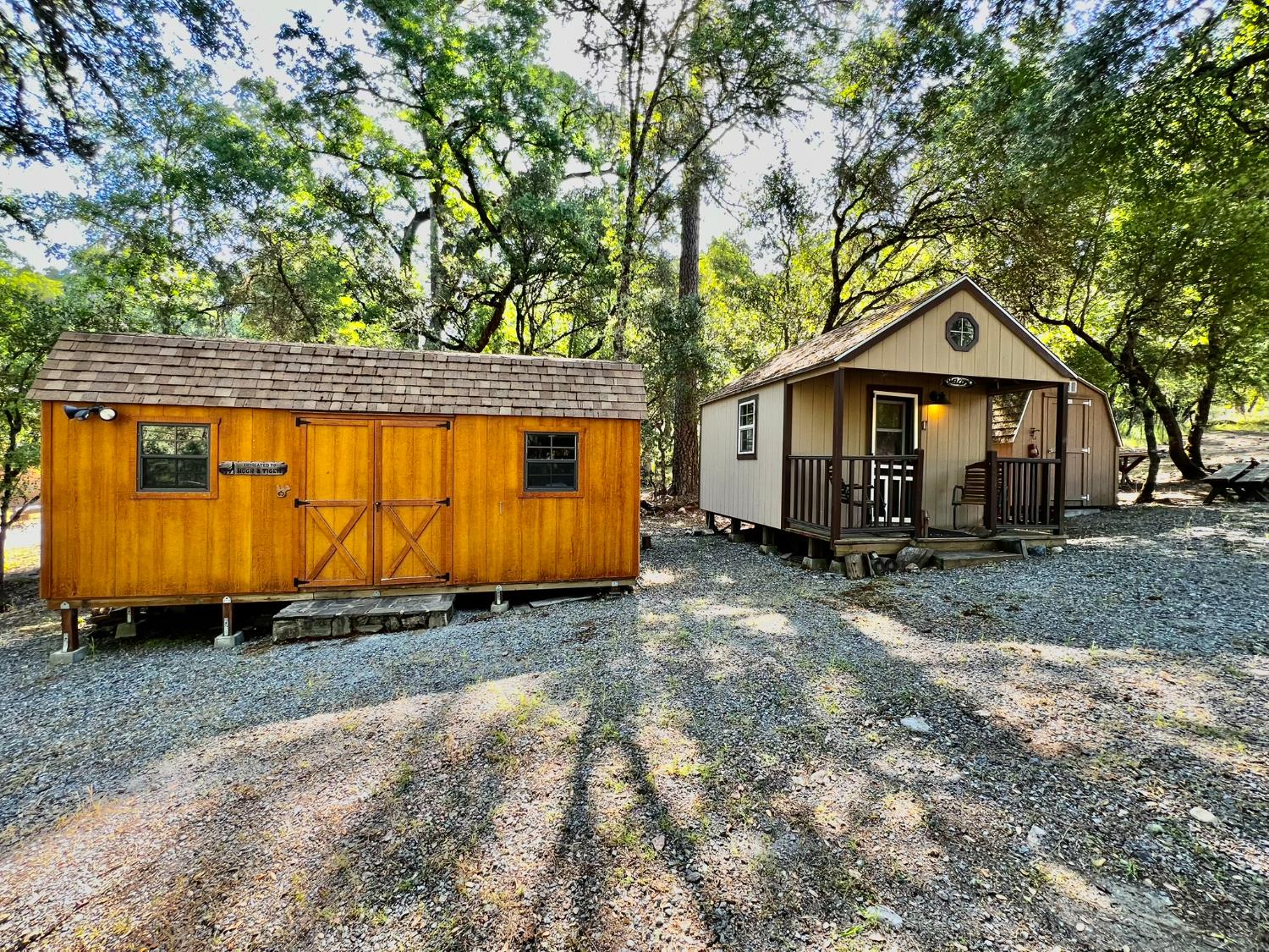 9110 Hidden Valley Road Mountain Ranch, CA 95246 - Photo 25 of 44 a view of a house with a yard and wooden fence
