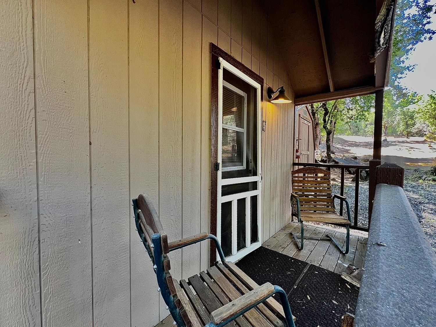 9110 Hidden Valley Road Mountain Ranch, CA 95246 - Photo 32 of 44 a view of a livingroom with furniture and staircase