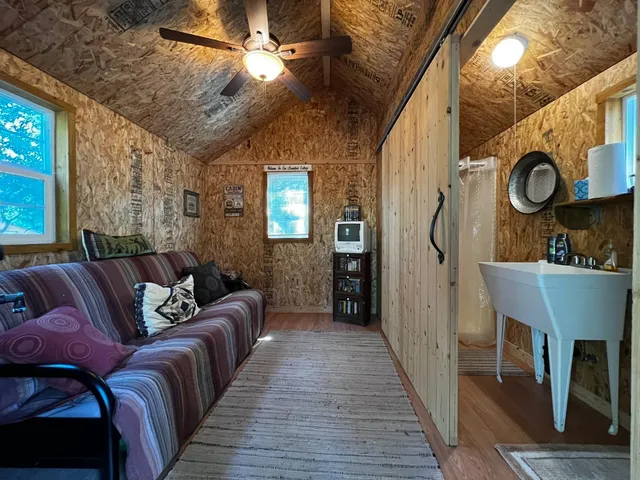 a bathroom with a sink mirror toilet and shower